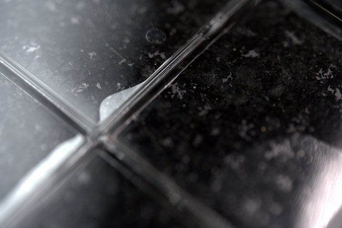 Macro detail of a demoulded silicone optical part edge and surface finish on inspection surface